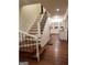 Elegant staircase with dark wood treads and wrought-iron railing at 1420 Donnelly Ave, Atlanta, GA 30310