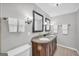 Bathroom featuring double sink vanity with granite countertop, tiled floor and modern lighting at 3252 Clairmont North Ne, Brookhaven, GA 30329