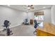 Home office with desk, chair, exercise bike and ceiling fan at 3252 Clairmont North Ne, Brookhaven, GA 30329