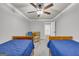 Charming bedroom with twin beds, ceiling fan and sitting area at 3252 Clairmont North Ne, Brookhaven, GA 30329