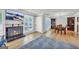 Open concept living and dining area with hardwood floors and built-in shelving at 3252 Clairmont North Ne, Brookhaven, GA 30329