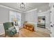 Bright entryway with hardwood floors, coat rack, and comfortable seating at 3252 Clairmont North Ne, Brookhaven, GA 30329