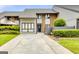 Brick front townhouse with driveway and landscaping at 3252 Clairmont North Ne, Brookhaven, GA 30329