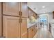 Modern kitchen with wood cabinets, granite counters, and stainless steel appliances at 3252 Clairmont North Ne, Brookhaven, GA 30329