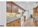 Modern kitchen with wood cabinets, granite counters, and stainless steel appliances at 3252 Clairmont North Ne, Brookhaven, GA 30329