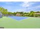 Well-maintained community tennis court with lighting for evening play at 3252 Clairmont North Ne, Brookhaven, GA 30329