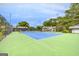 Beautiful tennis court surrounded by lush greenery in the community at 3252 Clairmont North Ne, Brookhaven, GA 30329