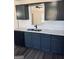 Modern kitchen showcasing sleek countertops, gray cabinets, and stainless steel appliances at 415 Dove Ln, Social Circle, GA 30025