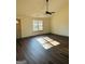 Bright living room with stylish wood floors and a window that provides natural light at 415 Dove Ln, Social Circle, GA 30025