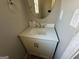 Stylish half bathroom with vanity and quartz countertop at 4010 Peachtree Farms Rd, Rex, GA 30273