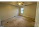 Spacious bedroom with large window and ceiling fan at 4010 Peachtree Farms Rd, Rex, GA 30273