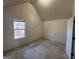 Bright bedroom with window and vaulted ceiling at 4010 Peachtree Farms Rd, Rex, GA 30273