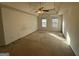 Spacious bedroom with ceiling fan and two windows at 4010 Peachtree Farms Rd, Rex, GA 30273