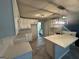Modern kitchen with white cabinets and quartz countertops at 4010 Peachtree Farms Rd, Rex, GA 30273