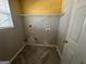 Functional laundry room with shelving and chevron flooring at 4010 Peachtree Farms Rd, Rex, GA 30273
