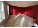 Spacious living room with red walls and carpet at 4010 Peachtree Farms Rd, Rex, GA 30273