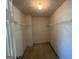 Spacious walk-in closet with double hanging rods at 4010 Peachtree Farms Rd, Rex, GA 30273
