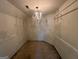 Large walk-in closet with chandelier at 4010 Peachtree Farms Rd, Rex, GA 30273