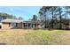 Ranch style home with a covered porch and spacious yard at 65 Merideth Trce, Sharpsburg, GA 30277