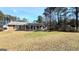 Ranch style home with a covered porch and spacious yard at 65 Merideth Trce, Sharpsburg, GA 30277