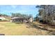 Ranch style home with a covered porch and spacious yard at 65 Merideth Trce, Sharpsburg, GA 30277
