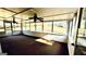 Bright screened porch with ceiling fans and views of the backyard at 65 Merideth Trce, Sharpsburg, GA 30277