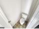 Cozy bathroom featuring a standard toilet and neutral flooring at 1535 Valley Club Dr, Lawrenceville, GA 30044