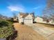 Charming home with a two-car garage and well-maintained landscaping at 1535 Valley Club Dr, Lawrenceville, GA 30044