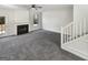 Bright living room features a fireplace, ceiling fan, and new carpet at 1535 Valley Club Dr, Lawrenceville, GA 30044