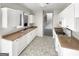 Open kitchen with white cabinetry and view of the stairs and living area at 1535 Valley Club Dr, Lawrenceville, GA 30044