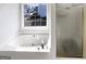A bright bathroom with a window and a shower at 1535 Valley Club Dr, Lawrenceville, GA 30044