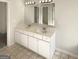 Bathroom featuring double sink vanity with ample counter space and storage at 1535 Valley Club Dr, Lawrenceville, GA 30044