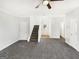 Bright living room featuring neutral paint, plush carpet, and ample natural light at 1535 Valley Club Dr, Lawrenceville, GA 30044