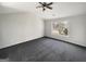 Bright bedroom with vaulted ceiling, gray carpet, and large window overlooking the yard at 1535 Valley Club Dr, Lawrenceville, GA 30044