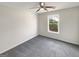 A bright bedroom with fresh paint, plush carpet, and a large window at 1535 Valley Club Dr, Lawrenceville, GA 30044