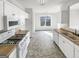 Functional kitchen with white appliances, gas range, and ample counter space at 1535 Valley Club Dr, Lawrenceville, GA 30044
