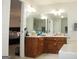 Double vanity bathroom with soaking tub and access to bedroom at 155 Carriage Gate Dr, Sharpsburg, GA 30277