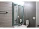 Bathroom with teal mirror, white sink and wood-paneled walls at 155 Carriage Gate Dr, Sharpsburg, GA 30277