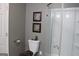 Bathroom with toilet, shower and gray walls at 155 Carriage Gate Dr, Sharpsburg, GA 30277