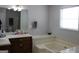 Bathroom with double vanity and soaking tub at 155 Carriage Gate Dr, Sharpsburg, GA 30277