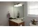 Clean bathroom with vanity, mirror, and shower at 155 Carriage Gate Dr, Sharpsburg, GA 30277