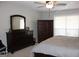 Bright bedroom featuring a dresser and large bed at 155 Carriage Gate Dr, Sharpsburg, GA 30277