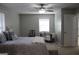 Large bedroom with a king-size bed and plenty of natural light at 155 Carriage Gate Dr, Sharpsburg, GA 30277