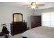 Bedroom with a dresser and large bed, offering ample space at 155 Carriage Gate Dr, Sharpsburg, GA 30277