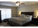 Spacious primary bedroom with large window and ceiling fan at 155 Carriage Gate Dr, Sharpsburg, GA 30277