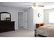 Main bedroom with a dresser and access to other rooms at 155 Carriage Gate Dr, Sharpsburg, GA 30277