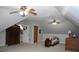 Large bonus room with two ceiling fans and plenty of storage at 155 Carriage Gate Dr, Sharpsburg, GA 30277