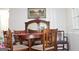 Classic dining room with a wood table and sideboard at 155 Carriage Gate Dr, Sharpsburg, GA 30277