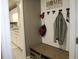 Home entry with built-in bench and storage at 155 Carriage Gate Dr, Sharpsburg, GA 30277