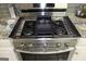 Stainless steel gas stove with griddle at 155 Carriage Gate Dr, Sharpsburg, GA 30277